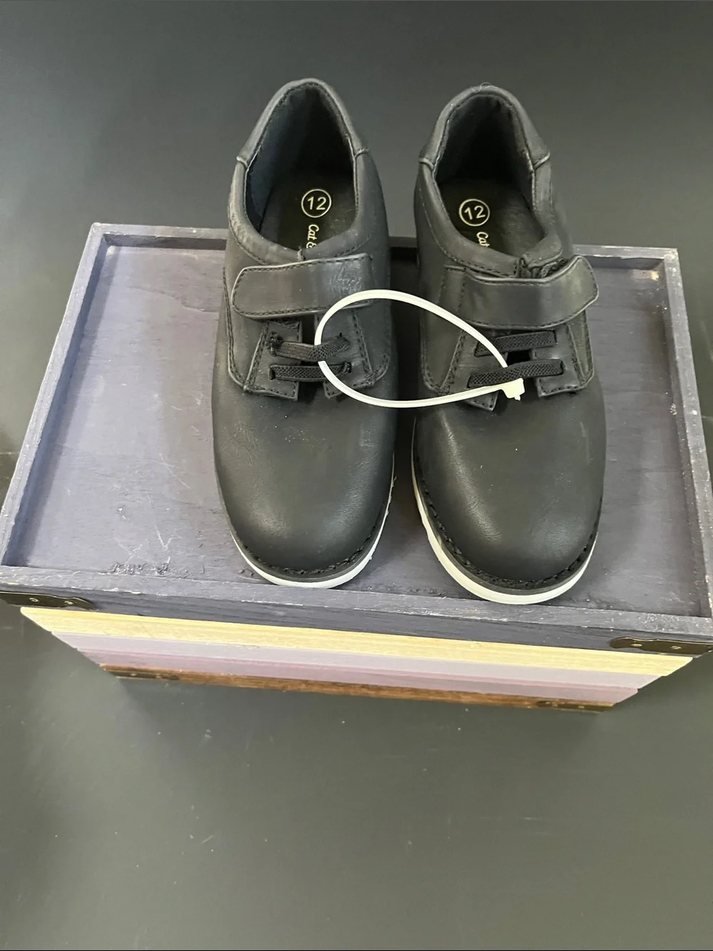 Black faux leather sneakers